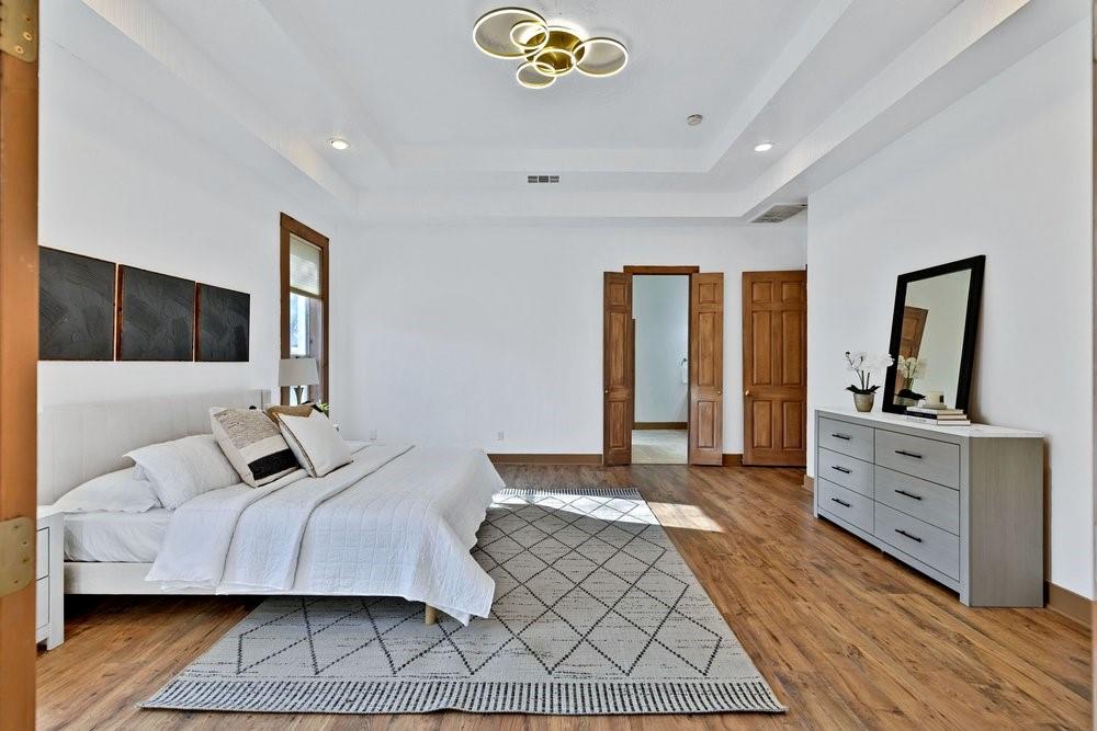 324 Rolling Oaks Ridge Cedar Hill, TX 75104 - Photo 14 of 39 a bedroom with a bed and a dresser