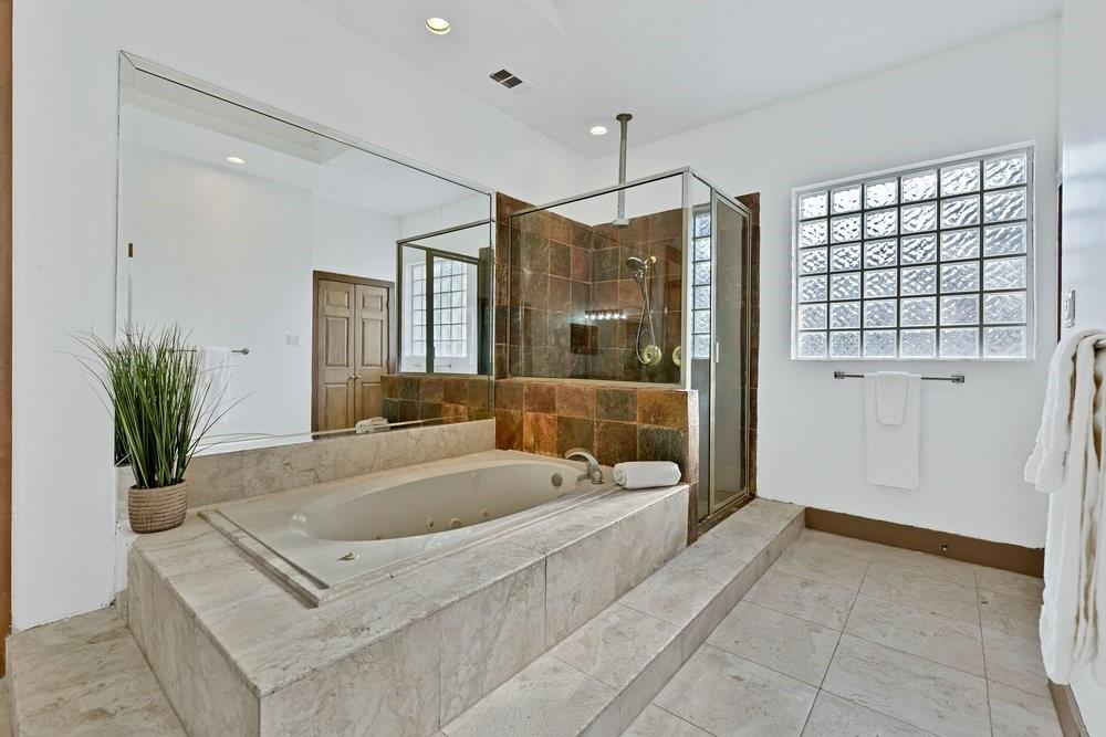 324 Rolling Oaks Ridge Cedar Hill, TX 75104 - Photo 18 of 39 a spacious bathroom with a tub shower and sink