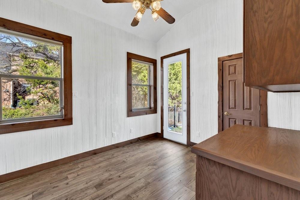 324 Rolling Oaks Ridge Cedar Hill, TX 75104 - Photo 20 of 39 a view of a room with wooden floor and window