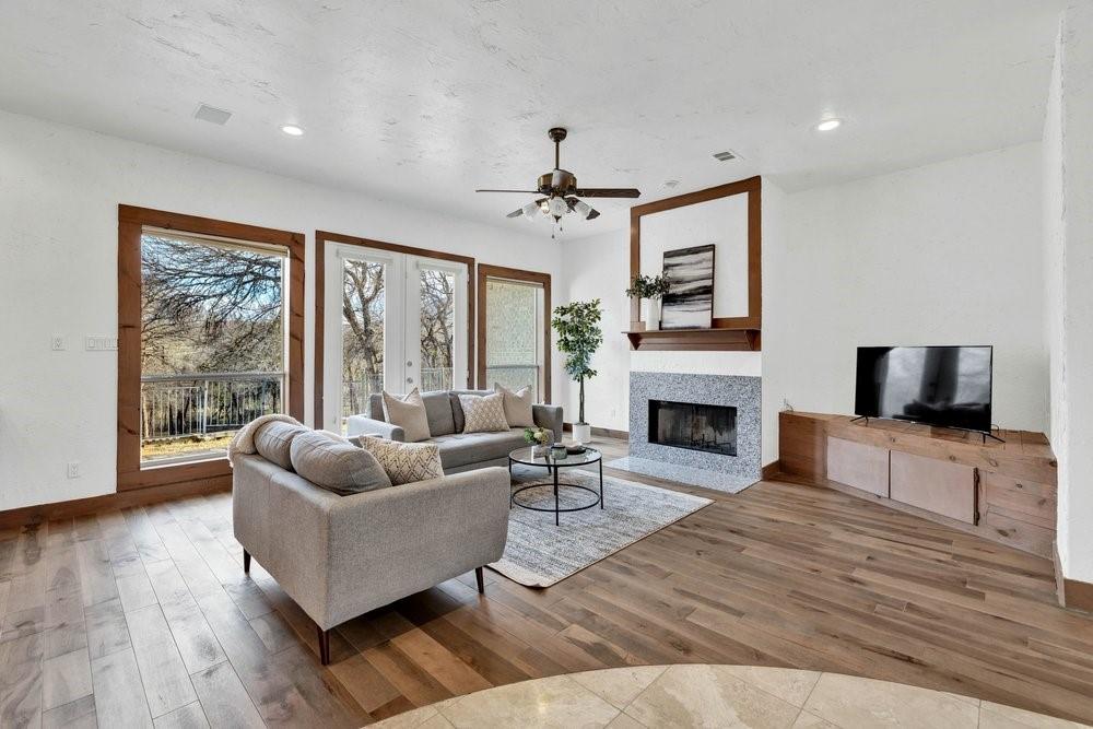 324 Rolling Oaks Ridge Cedar Hill, TX 75104 - Photo 3 of 39 a living room with furniture fireplace and flat screen tv
