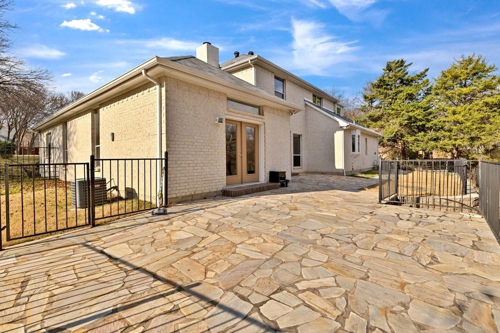324 Rolling Oaks Ridge Cedar Hill, TX 75104 - Photo 35 of 39 a front view of a house with a yard