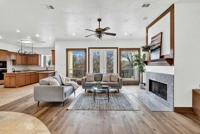 a living room with furniture and a fireplace