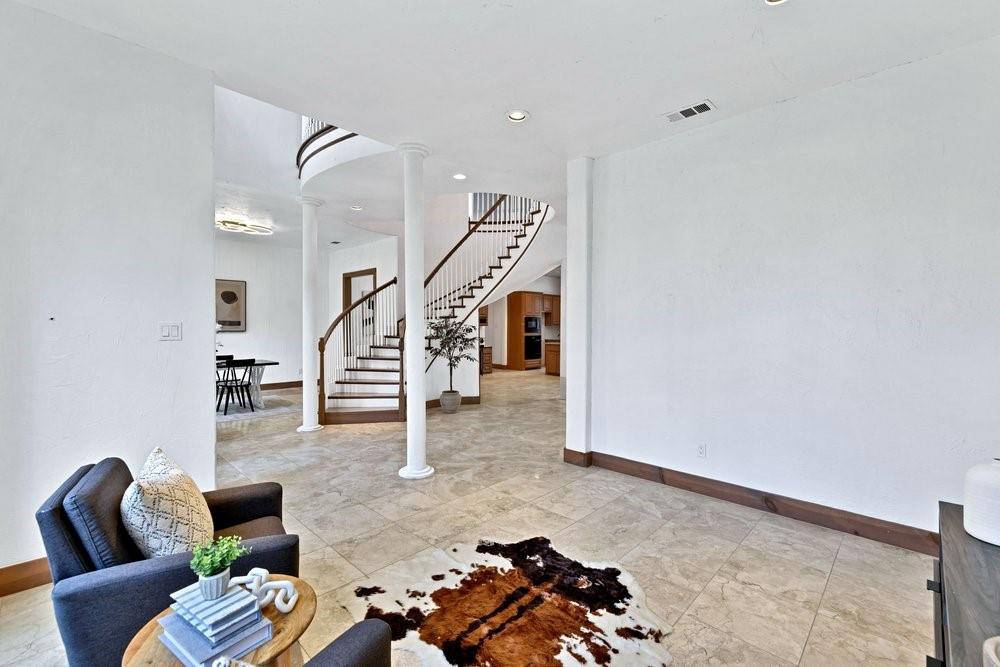 324 Rolling Oaks Ridge Cedar Hill, TX 75104 - Photo 10 of 39 a living room with furniture and stairs