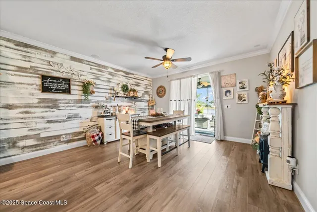 a view of a livingroom with furniture and a flat screen tv