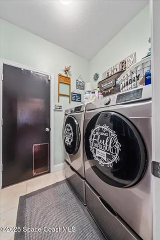 a utility room with dryer and washer