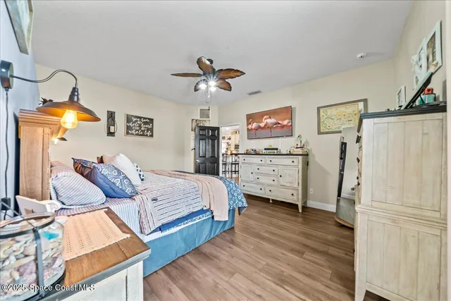 a bedroom with bed and cabinets
