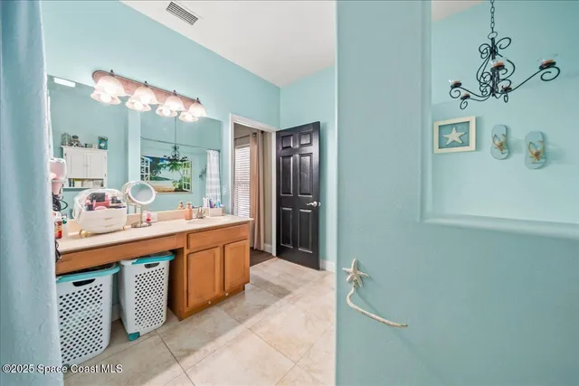 a large bathroom with a double vanity sink and a mirror