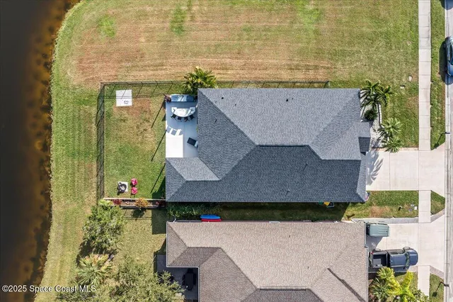 an aerial view of a house with swimming pool