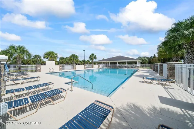 a view of a swimming pool with a lake view
