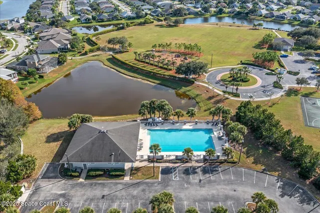 an aerial view of a house with a lake view