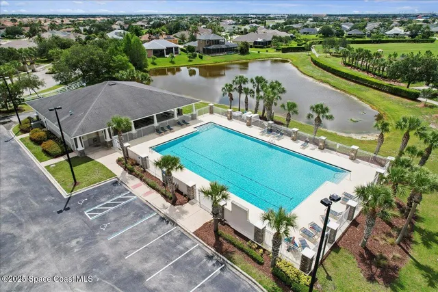 an aerial view of a house with a lake view
