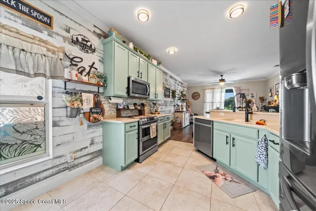 a kitchen with stainless steel appliances and cabinets