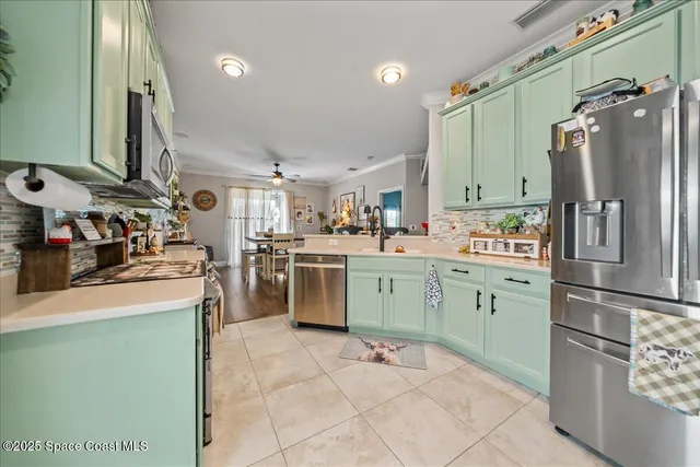 a kitchen with cabinets a washer and dryer