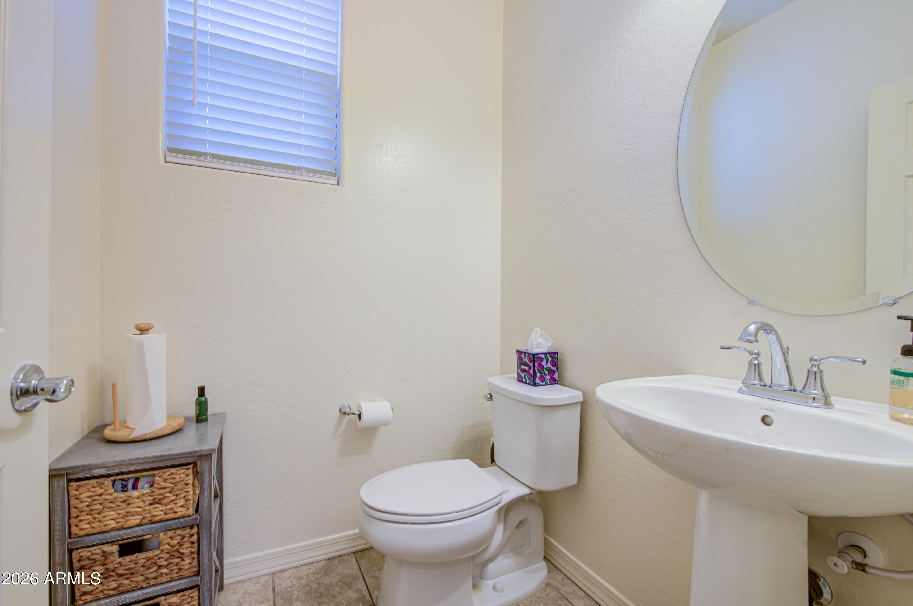 1705 South 83rd Way Mesa, AZ 85209 - Photo 15 of 39 a bathroom with a toilet sink and mirror