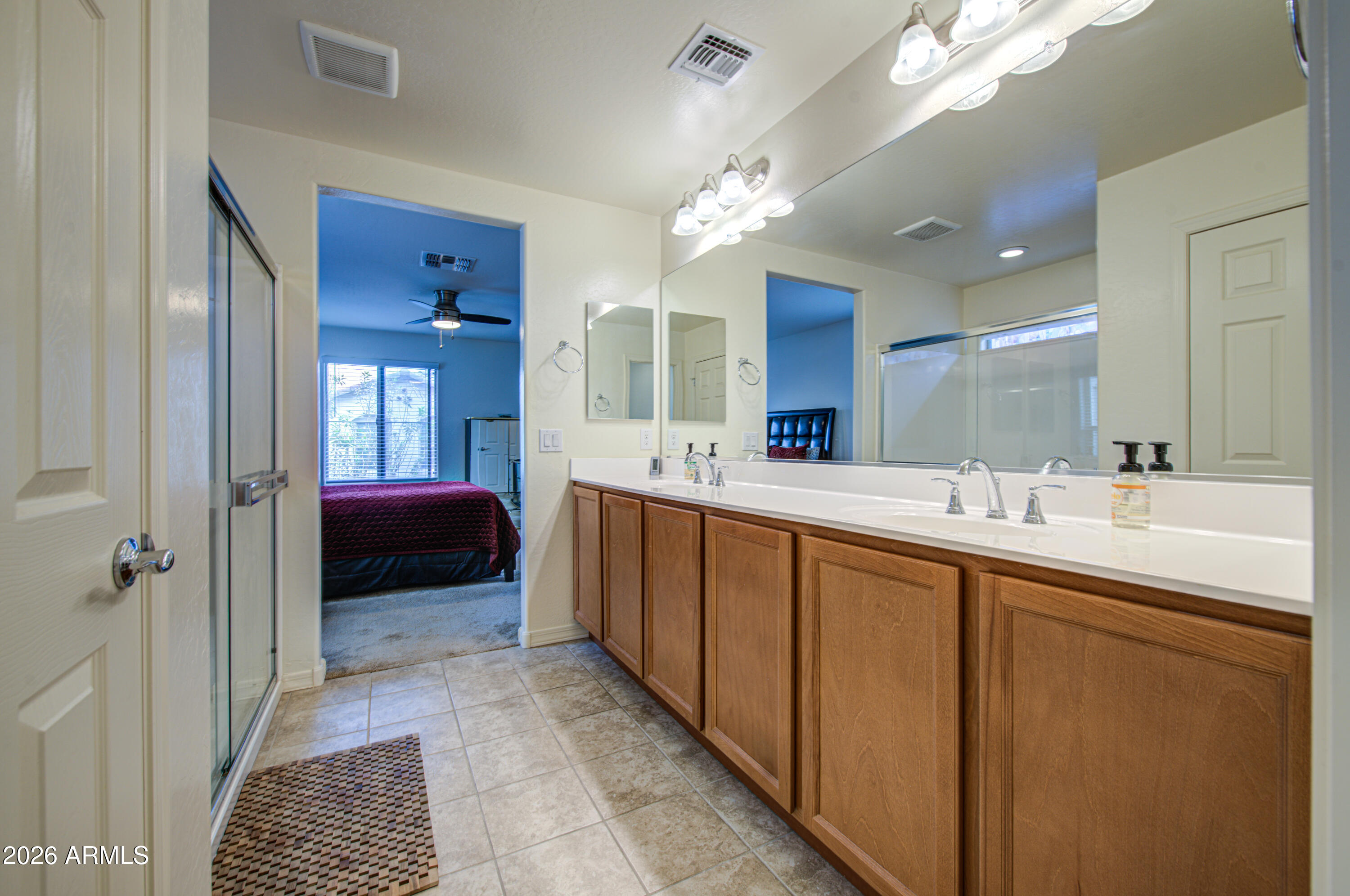 1705 South 83rd Way Mesa, AZ 85209 - Photo 22 of 39 a spacious bathroom with a double vanity sink a mirror and a shower