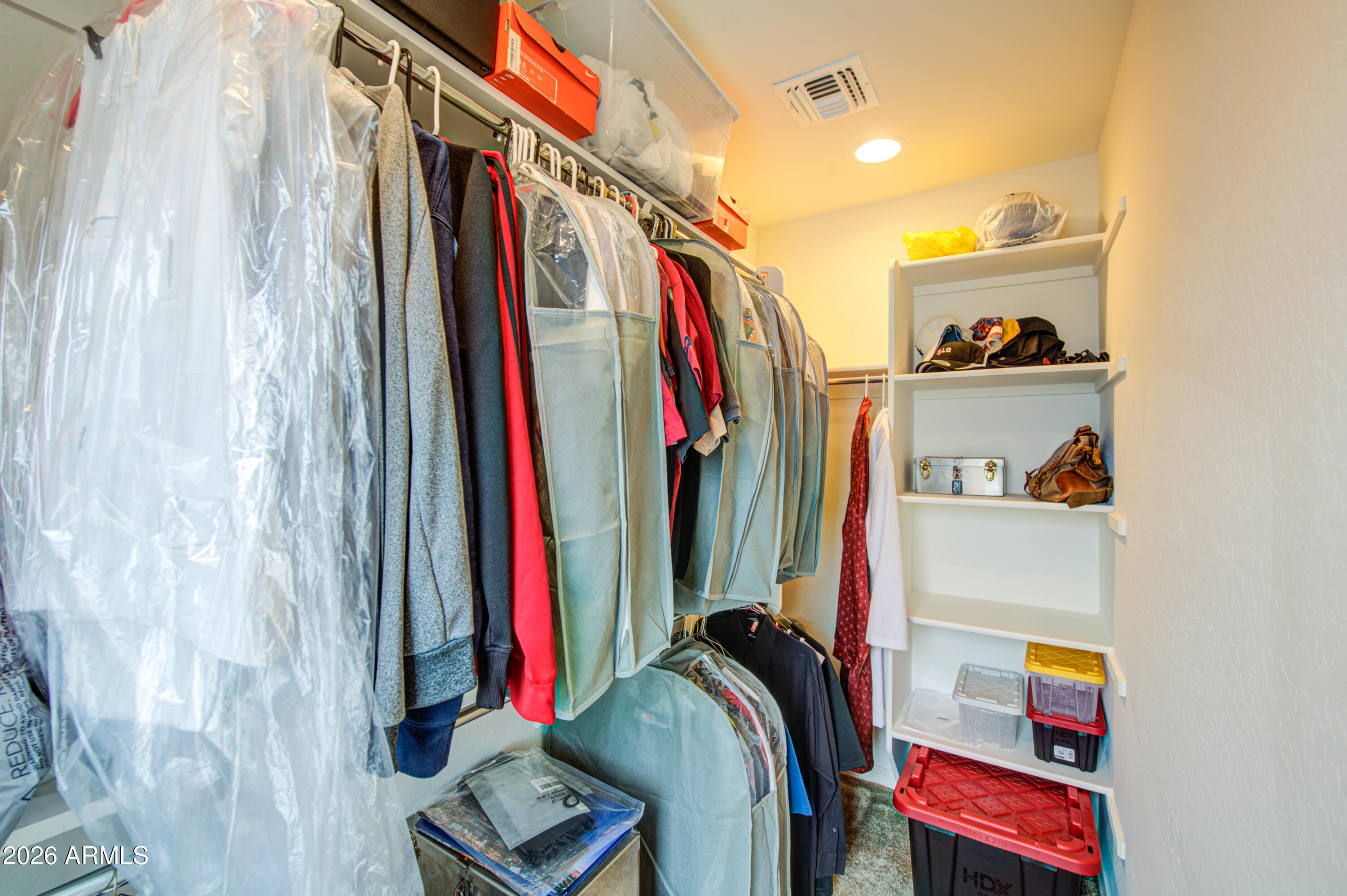 1705 South 83rd Way Mesa, AZ 85209 - Photo 23 of 39 a view of walk in closet with clothes and shoes