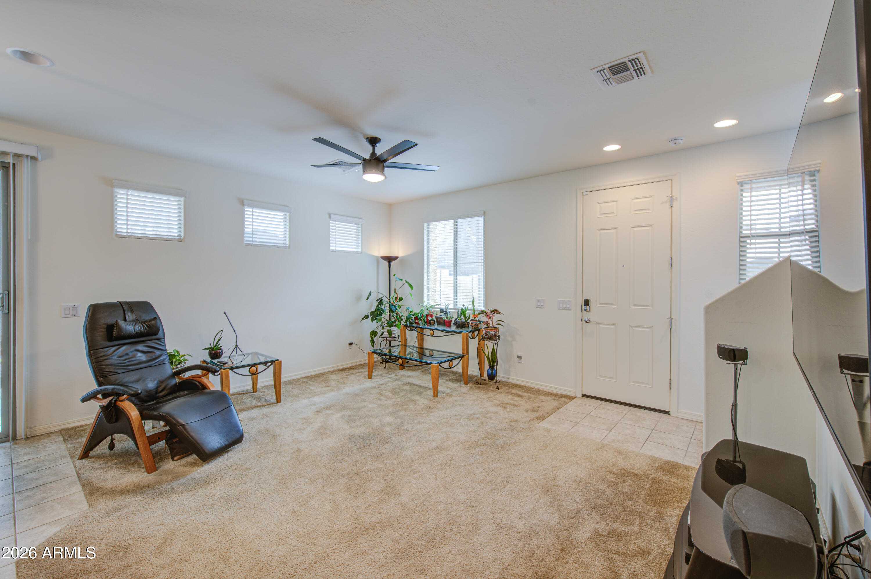 1705 South 83rd Way Mesa, AZ 85209 - Photo 32 of 39 a view of a workspace with furniture and a window