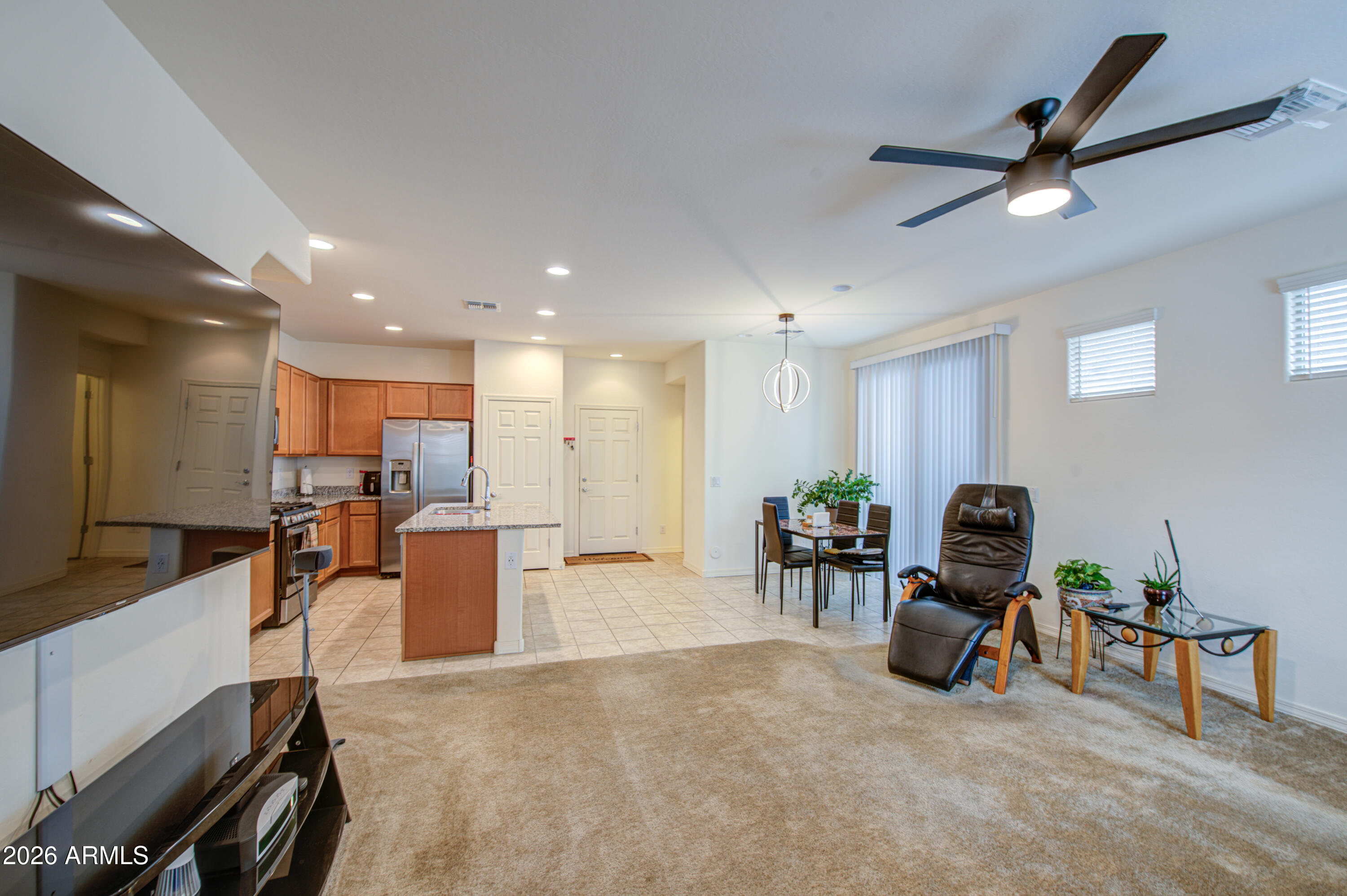 1705 South 83rd Way Mesa, AZ 85209 - Photo 8 of 39 a living room with furniture and a ceiling fan