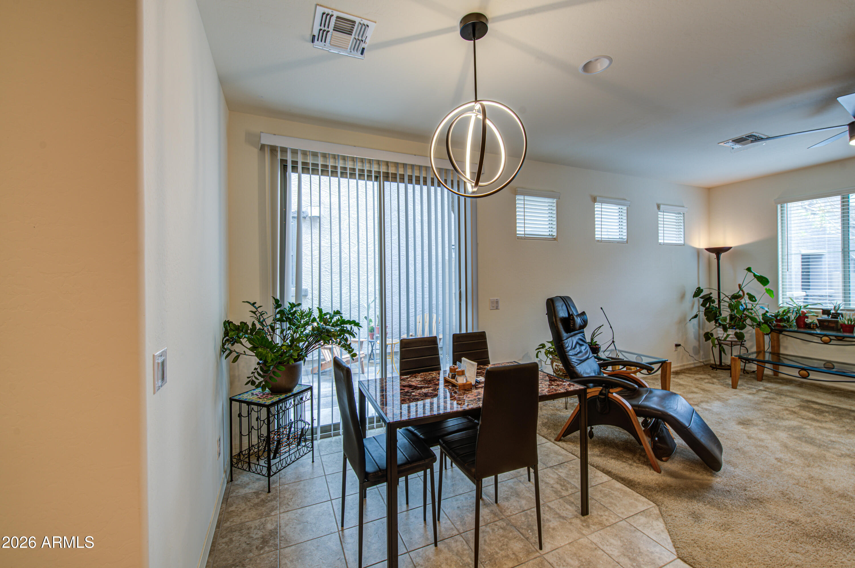 1705 South 83rd Way Mesa, AZ 85209 - Photo 9 of 39 a view of a dining room with furniture window and flowerpot