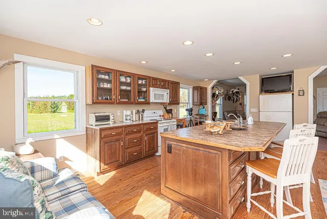 a view of a living room with furniture and staircase
