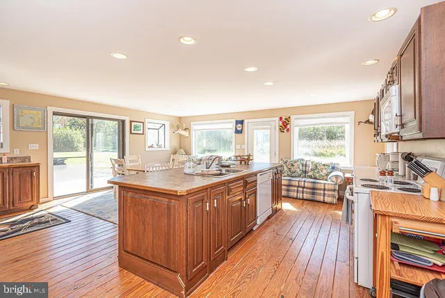 a bedroom with a bed a table and chair