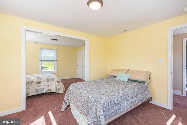 a house view with swimming pool in front of it