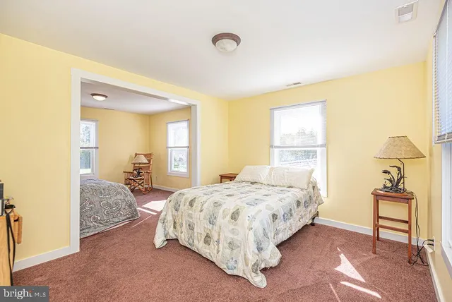 a view of a house with swimming pool and sitting area