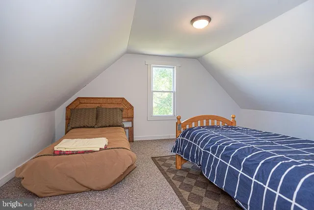 a view of a lake with beach and city view
