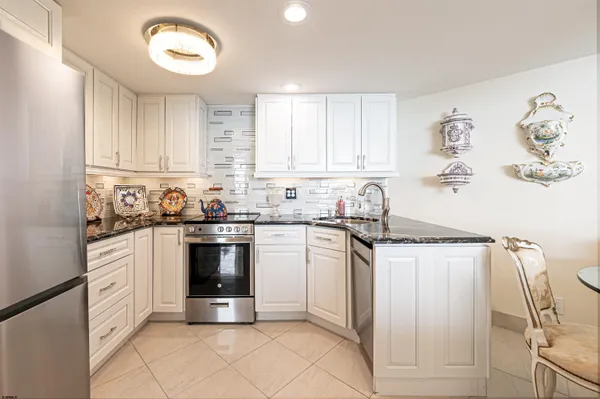 a bedroom with bed and wooden floor