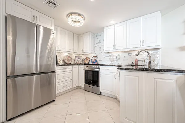 a bed room with a bed and a chair