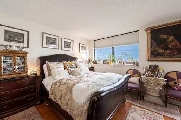 a bathroom with a granite countertop sink mirror and a shower