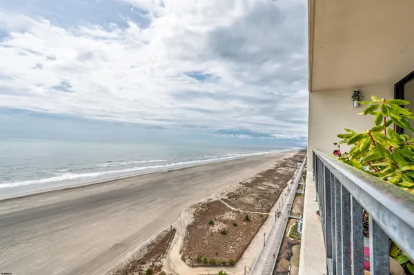 a view of swimming pool with a yard and sitting area