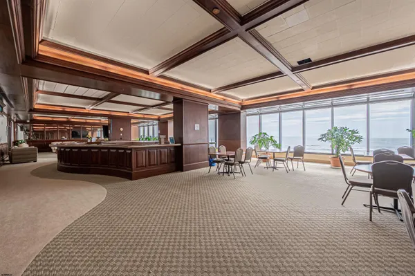 a view of a swimming pool with an outdoor seating and a yard