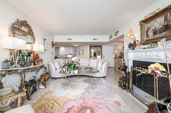 a kitchen with stainless steel appliances granite countertop a dining table and chairs