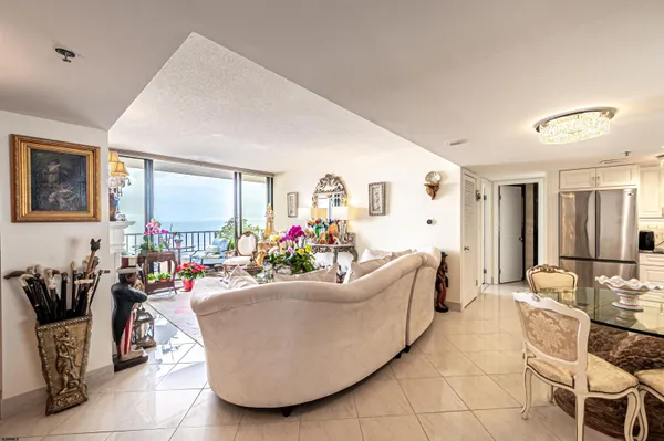 a kitchen with stainless steel appliances granite countertop a stove and white cabinets