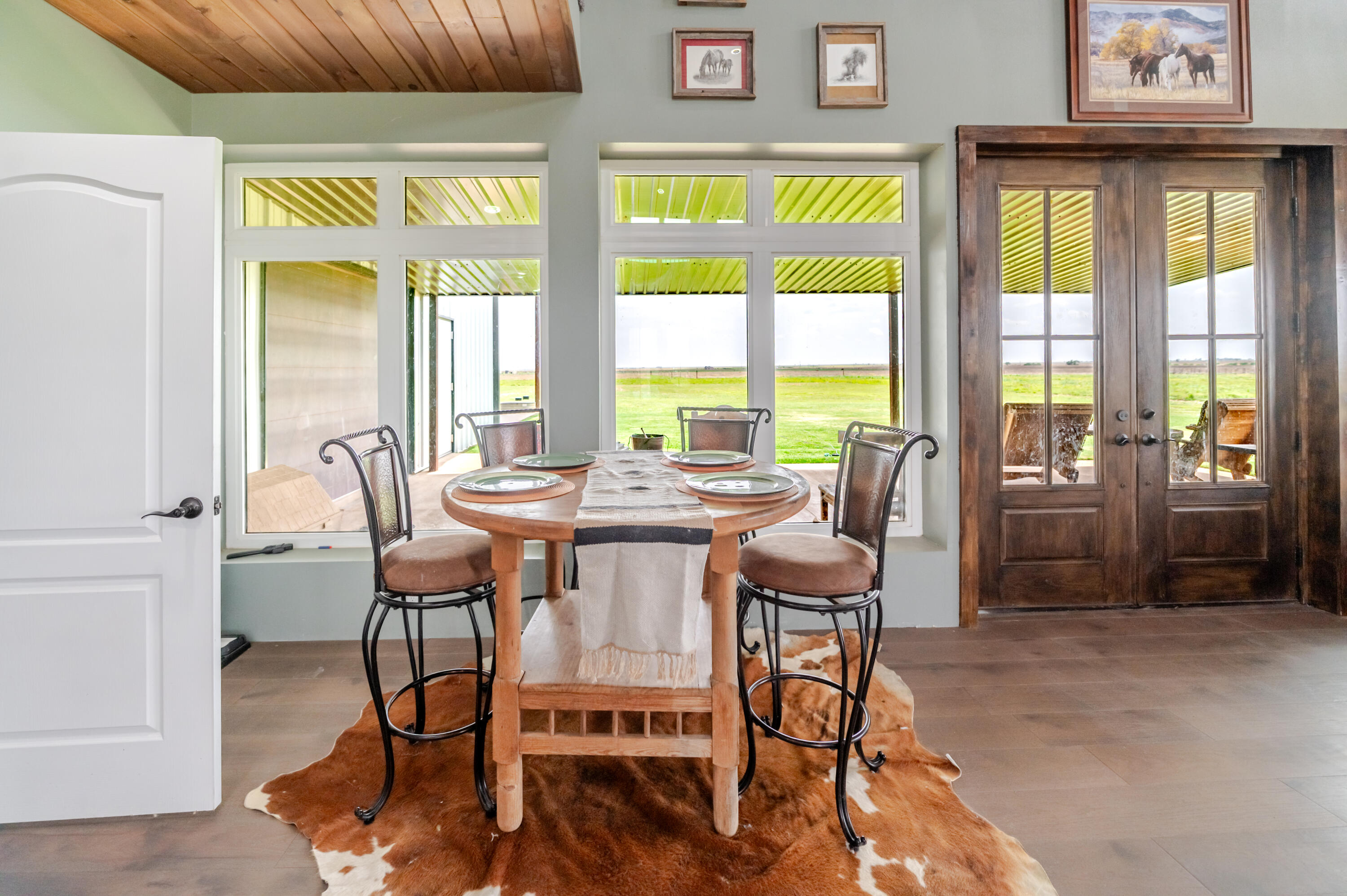 6792 Maine Road Anton, TX 79313 - Photo 70 of 77 a dining room with furniture and a floor to ceiling window