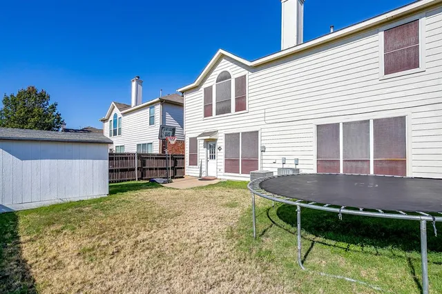 a house view with a sitting space and garden