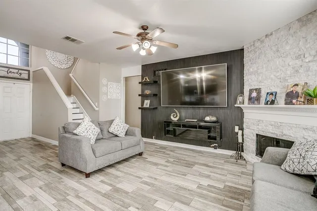 a living room with furniture and a flat screen tv