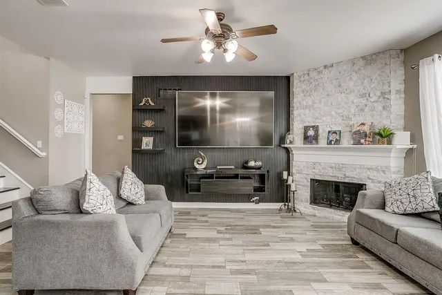 a living room with furniture and a fireplace