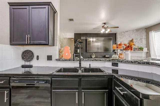 a kitchen with a stove and a sink