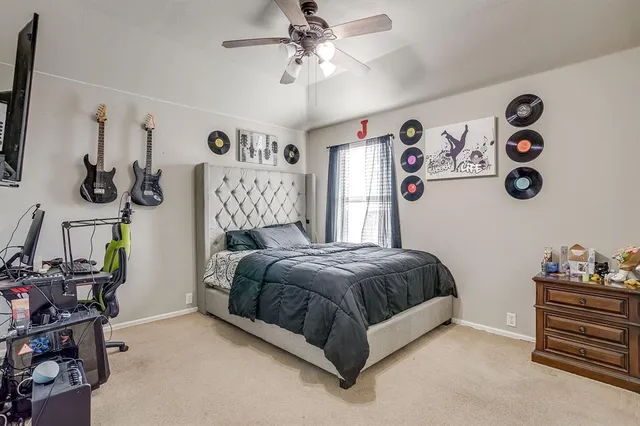a bedroom with a bed and cabinets