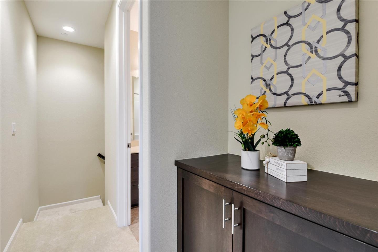 2038 Trento Loop Milpitas, CA 95035 - Photo 11 of 22 a view of table with a vase of flowers on it