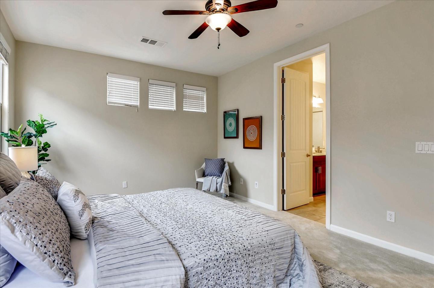 2038 Trento Loop Milpitas, CA 95035 - Photo 13 of 22 a bedroom with a bed and a chandelier