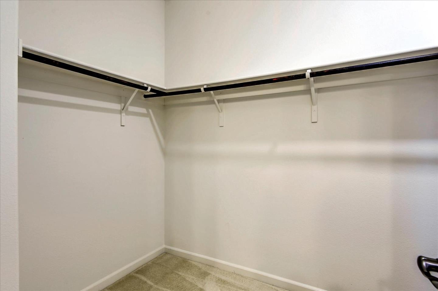 2038 Trento Loop Milpitas, CA 95035 - Photo 15 of 22 a view of a room with racks on the wall