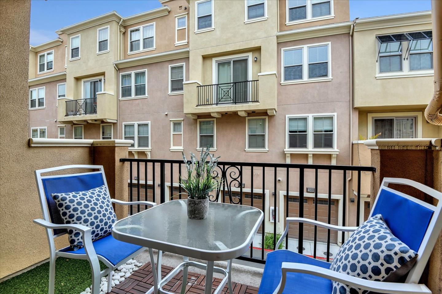 2038 Trento Loop Milpitas, CA 95035 - Photo 19 of 22 a balcony with table and chairs