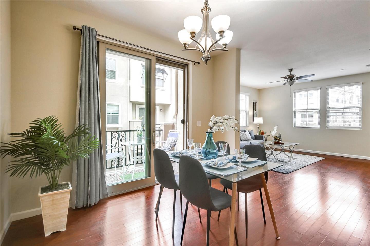 2038 Trento Loop Milpitas, CA 95035 - Photo 8 of 22 a view of a dining room with furniture window and wooden floor