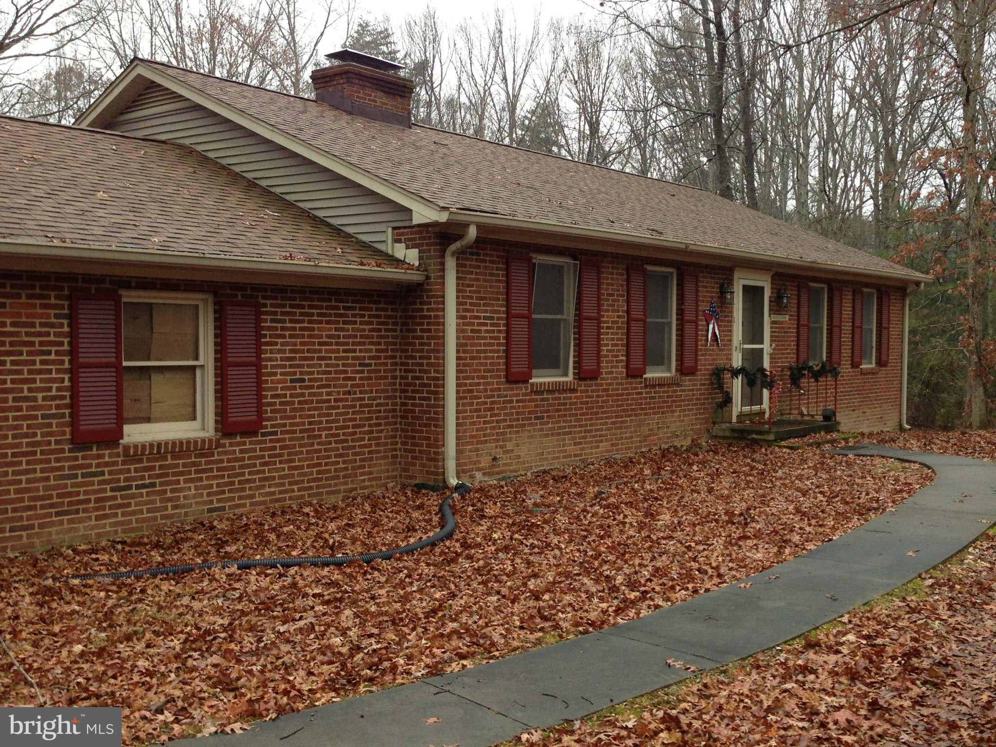 7602 River Road Fredericksburg, VA 22407 - Photo 1 of 7 a front view of a house with garden