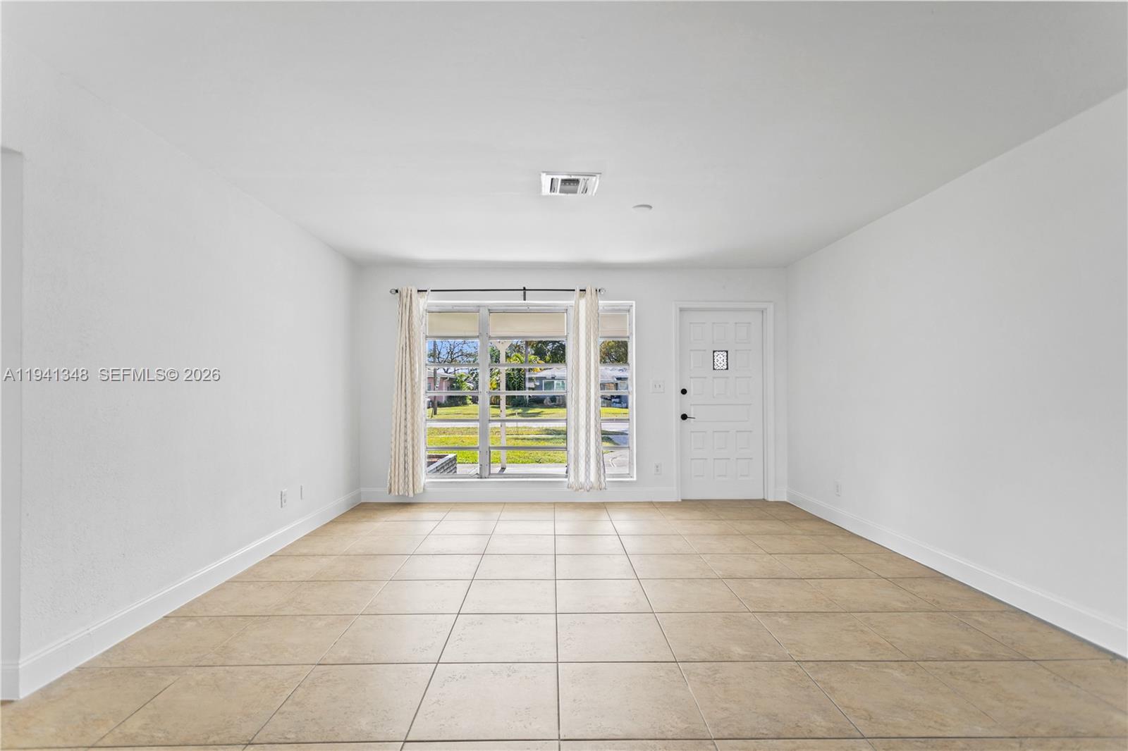 3253 Pierce Street Hollywood, FL 33021 - Photo 11 of 53 a view of an empty room with a window