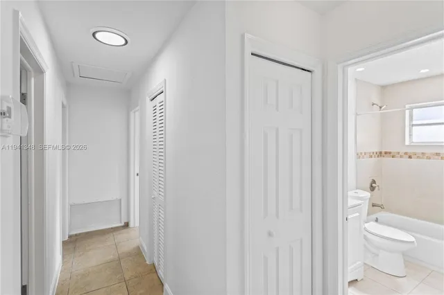 an empty room with a ceiling fan