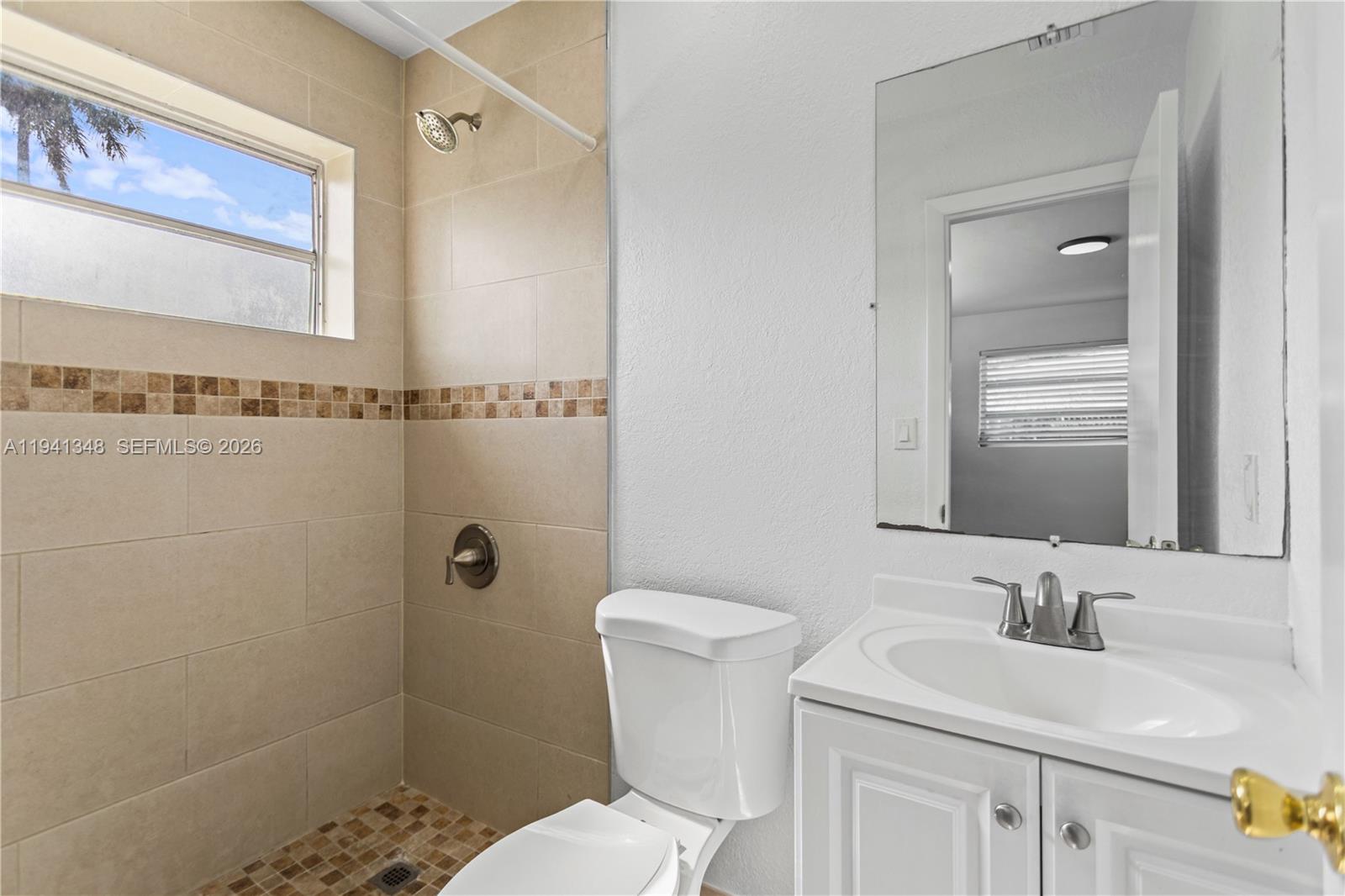 3253 Pierce Street Hollywood, FL 33021 - Photo 20 of 53 a bathroom with a sink toilet and shower